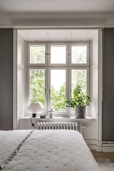 Арочные окна и гостиная с голубыми стенами: квартира в Стокгольме (90 кв. м)